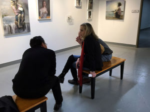 Photo: Looking at art in a gallery.